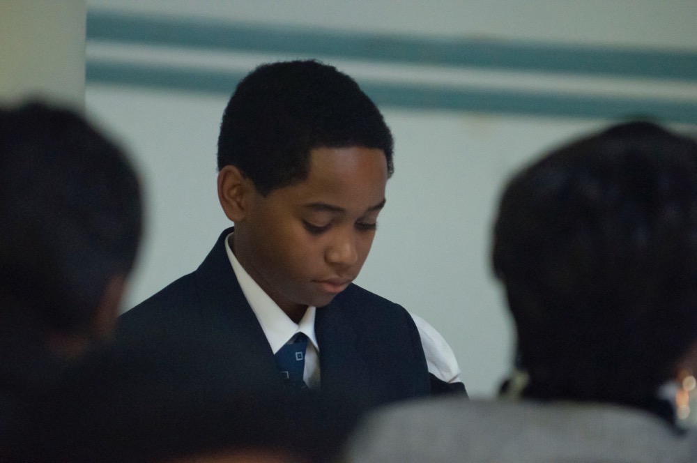 boy-looking-down-at-queens-luncheon