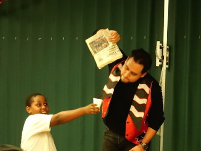 magican-performs-trick-with-boy-chrismas-toy-givaway